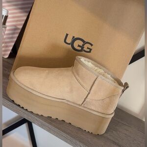 Only worn once-protected with weather spray/brand new with box